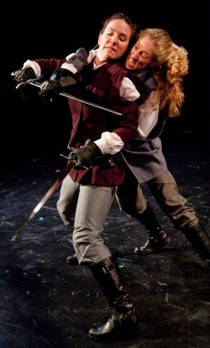 Macbeth (Kathrynne Wolf) defends herself from Macduff (Amy E. Harmon) Photo
